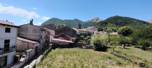 a view of a village with mountains in the background at House biase e marrys in Trecchina