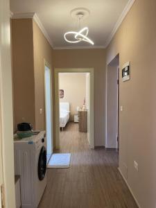 a living room with a washer and dryer in a house at Berat Central Home in Berat +25 photos
