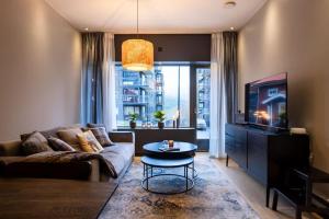 a living room with a couch and a table at View Apartments in Åre