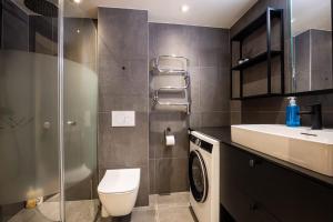 a bathroom with a toilet and a sink at View Apartments in Åre +41 photos
