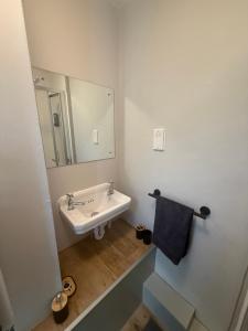 a bathroom with a sink and a mirror at The Fox Inn in Steventon