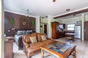 a living room with a couch and a bed at Ocean Dream - Kite Paradise! in Cabarete