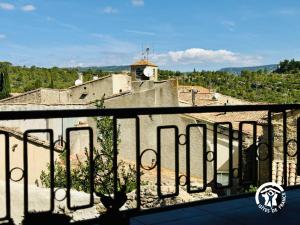 a view of a city from a balcony at Gîte de la jument rousse in Lagrasse