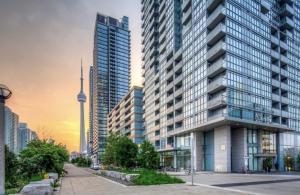 a tall building in a city with the cincinnati at Lakeview 1 Bed 1 Den by Rogers Centre in Toronto