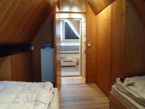 a small room with a bed and a bathroom at Haus Maya H-12 in Butjadingen