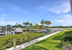 a marina at a resort with boats in the water at GBB 1335 Stunning Harbor View Condo on Siesta Key in Siesta Key