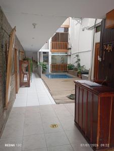 a hallway of a house with a pool in it at Yemayá hostal in Puerto López