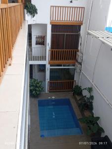 a small swimming pool on the balcony of a building at Yemayá hostal in Puerto López +12 photos