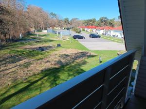 a view of a yard from a balcony at Haus am Prerow-Strand in Prerow