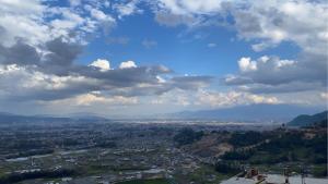 a view of a city under a cloudy sky at Cherry villa in Manamaiju