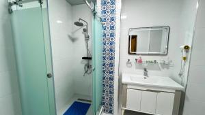 a bathroom with a shower and a sink at Mashkobi Buxoro in Bukhara +31 photos