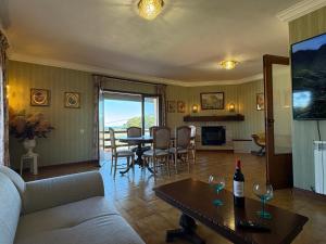 a living room with a couch and a table at Moledo Seaview in Moledo
