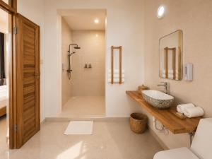 a bathroom with a sink and a shower at Smile Boutique Beach hotel in Nungwi +28 photos