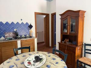a kitchen with a table with a plate on it at Marinella Retreat - Sole in Zambrone