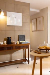 a table with a bowl of food on a table at Hôtel Madeleine Haussmann in Paris