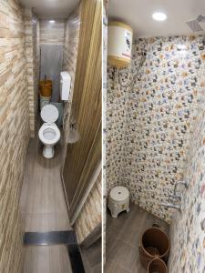 a bathroom with two toilets in a room at hotel shree guru pandey in Indore