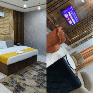 a hotel room with a bed and a tv at Indian Atlantic Hotel & Suites in Agbor