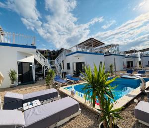 a villa with a swimming pool and a resort at Beach Bungalows Costinesti in Costinesti