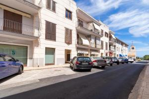 a row of cars parked on the side of a street at Casa Pia in Valledoria