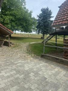 a brick yard with a gazebo and a field at Haus am Murgtalpfad 1 und 2 in Rickenbach