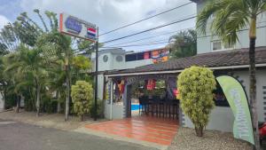 a building with a gazebo with a pool at Hotel Don Andres in Sosúa