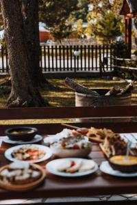 a table with plates of food on top of it at Kompleksi Zorgji in Theth +94 photos