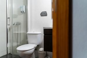 a bathroom with a toilet and a shower at Casa da Colina in Amarante +25 photos