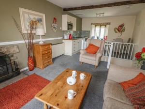 a living room with a couch and a coffee table at Kernot Cottage in Richmond