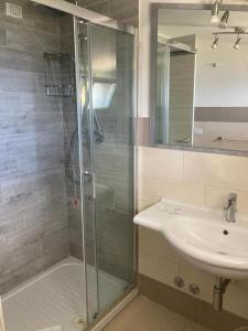 a bathroom with a shower and a sink at Tropea Residence - Pace in Tropea
