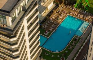 an overhead view of a large building with a swimming pool at Green Side Apart Hotel Official in Batumi