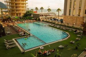 an overhead view of a swimming pool in a hotel at Green Side Apart Hotel Official in Batumi