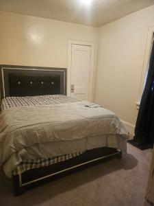 a bedroom with a large bed in a room at Plantlife LLC A in Minneapolis