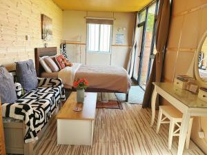 a small room with a bed and a couch at The Cabin in the Woods in Dublin