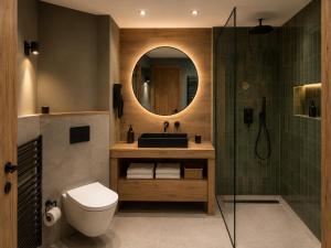 a bathroom with a sink and a mirror at Studio Premium ARC 1950 in Bourg-Saint-Maurice