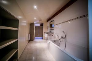 a bathroom with a bath tub and a shower at Castellu Rossu in Lucciana