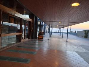 an empty hallway of a building with a view of the ocean at Luxury B&B La casa sul mare in Taranto