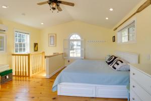 a bedroom with a bed and a ceiling fan at Pool, Dock + Rooftop Views! Bohannon Getaway in Bohannon +41 photos