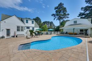 an image of a swimming pool in front of a house at Pool, Dock + Rooftop Views! Bohannon Getaway in Bohannon