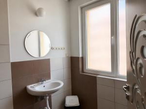 a bathroom with a sink and a mirror at Vanilla Garden Apartments in Sunny Beach +36 photos