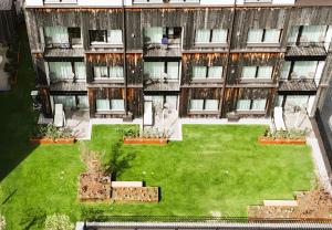 an aerial view of a building with a green yard at Hotel Andino in Sankt Anton am Arlberg