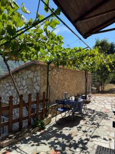 a patio with a table and a fence at B&B Al Bricco in Albisola Superiore