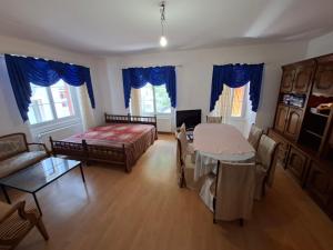a living room with a bed and a couch at Braui Pub and Restaurant in Waldenburg