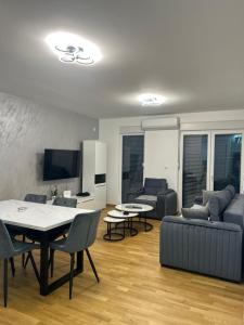 a living room with a couch and a table at Stan na dan in Loznica