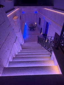 a set of stairs in a building at night at Relais V&G in Anagni