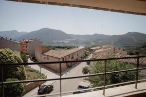 a view from a balcony of a town with a street at Hostal Bertran in Salás de Pallás