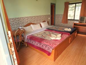 A bed or beds in a room at Lake Vision Guesthouse