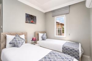 two beds in a room with a window at Villa Delfin in Ortaca +19 photos