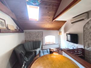 a living room with a couch and a table at Casa di Rose in Vrsar