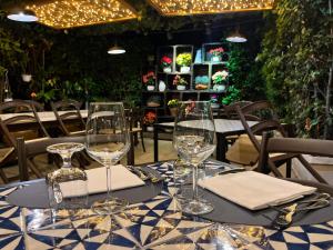 a table with wine glasses on top of it at Casa Rosanna in Meolo