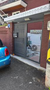 a car parked in front of a garage at stay mongle in Suwon